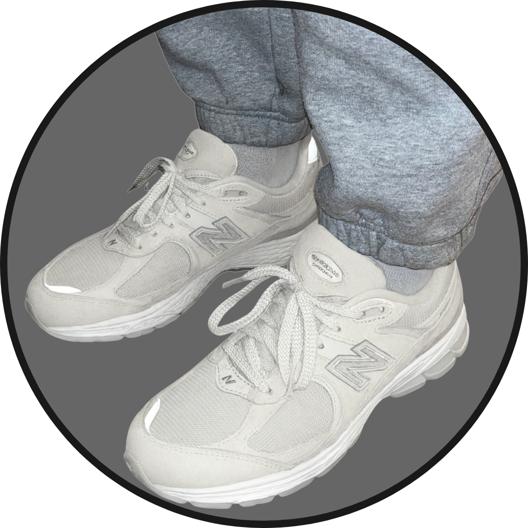 pair of new balance trainers on feet with Inchmaxxers 2.0 - Height Increasing Insoles inside